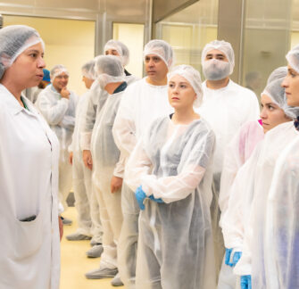 Photo of employees after the Coffee with Shareholders, visiting one of our factories.